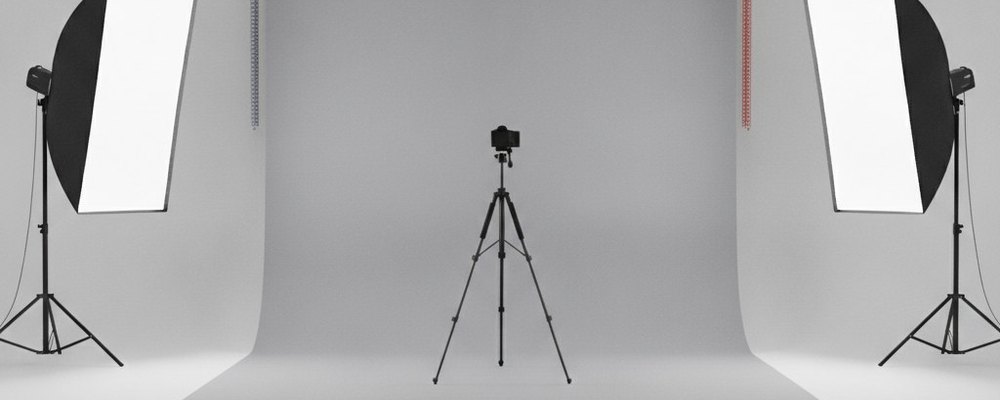 Studio photo avec un fond blanc et des boîtes à lumière